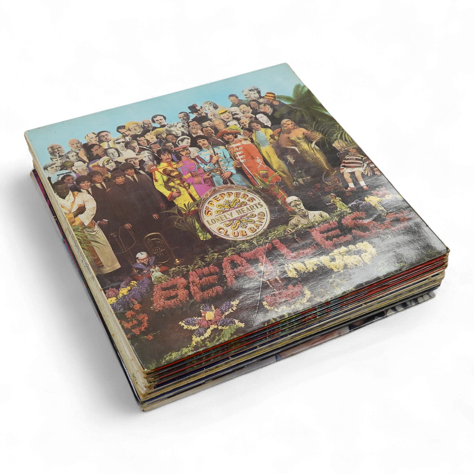 Fourteen LP record albums including eleven The Beatles and related; Sgt. Pepper’s Lonely Hearts Club Band (plus an additional three others), The Beatles at the Hollywood Bowl, Magical Mystery Tour, Revolver, etc., plus t